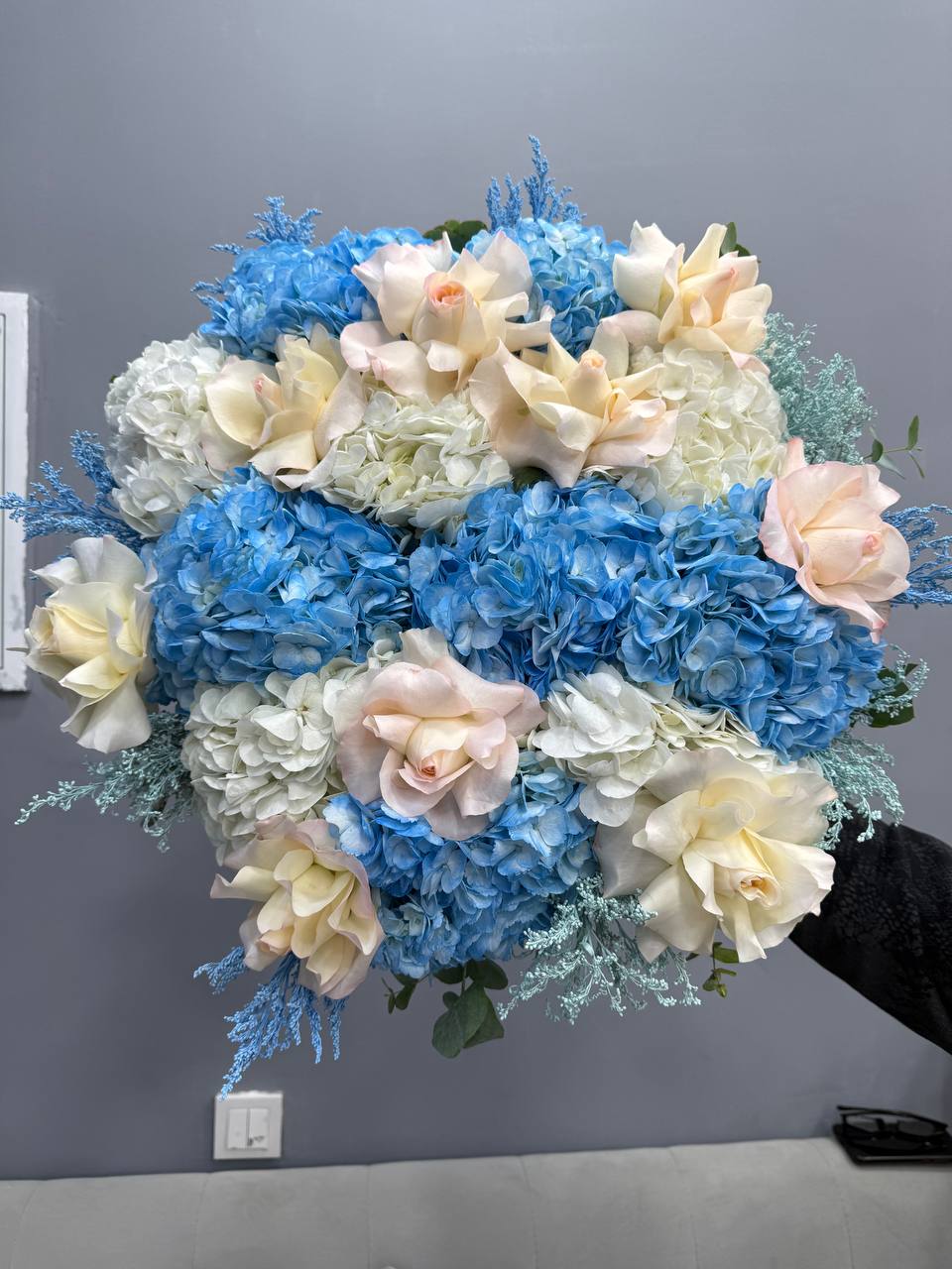 Blue hydrangea and rose bouquet