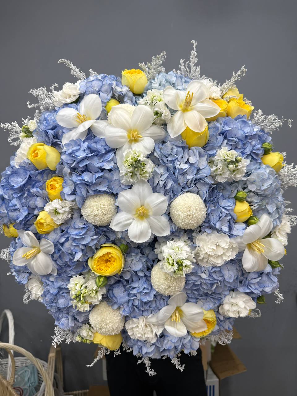 Blue hydrangea and yellow rose bouquet